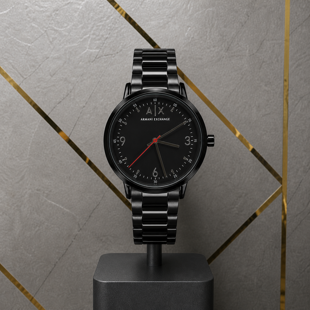 Armani Exchange Cayde black watch against gray and gold office wall