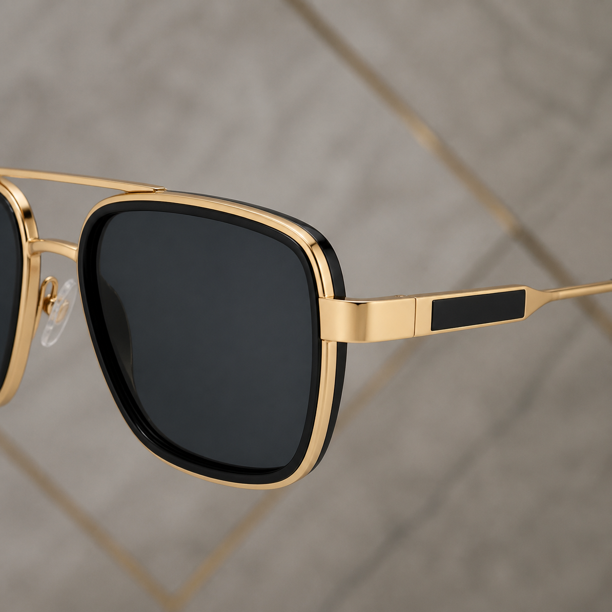 Ray-Ban gold-tone sunglasses frame and temple detail