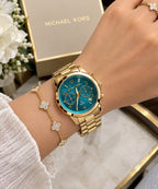 Michael Kors MK5815 gold-tone women’s watch worn on the wrist