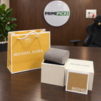 Small white Michael Kors OG box package in the PrimePicks office