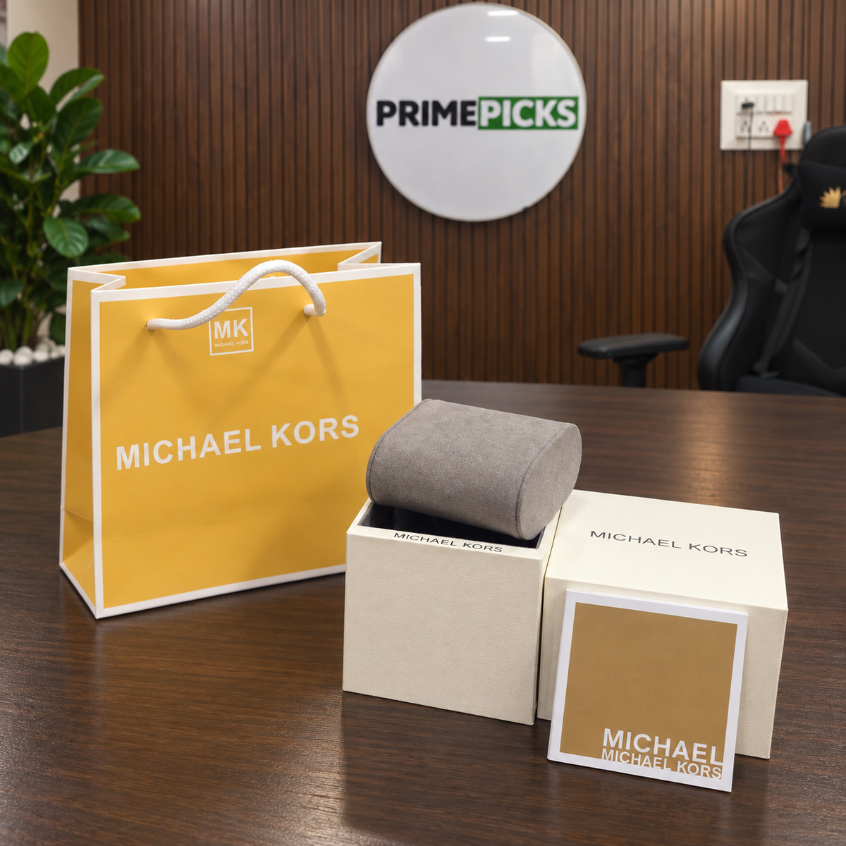 Small white Michael Kors OG box package in the PrimePicks office