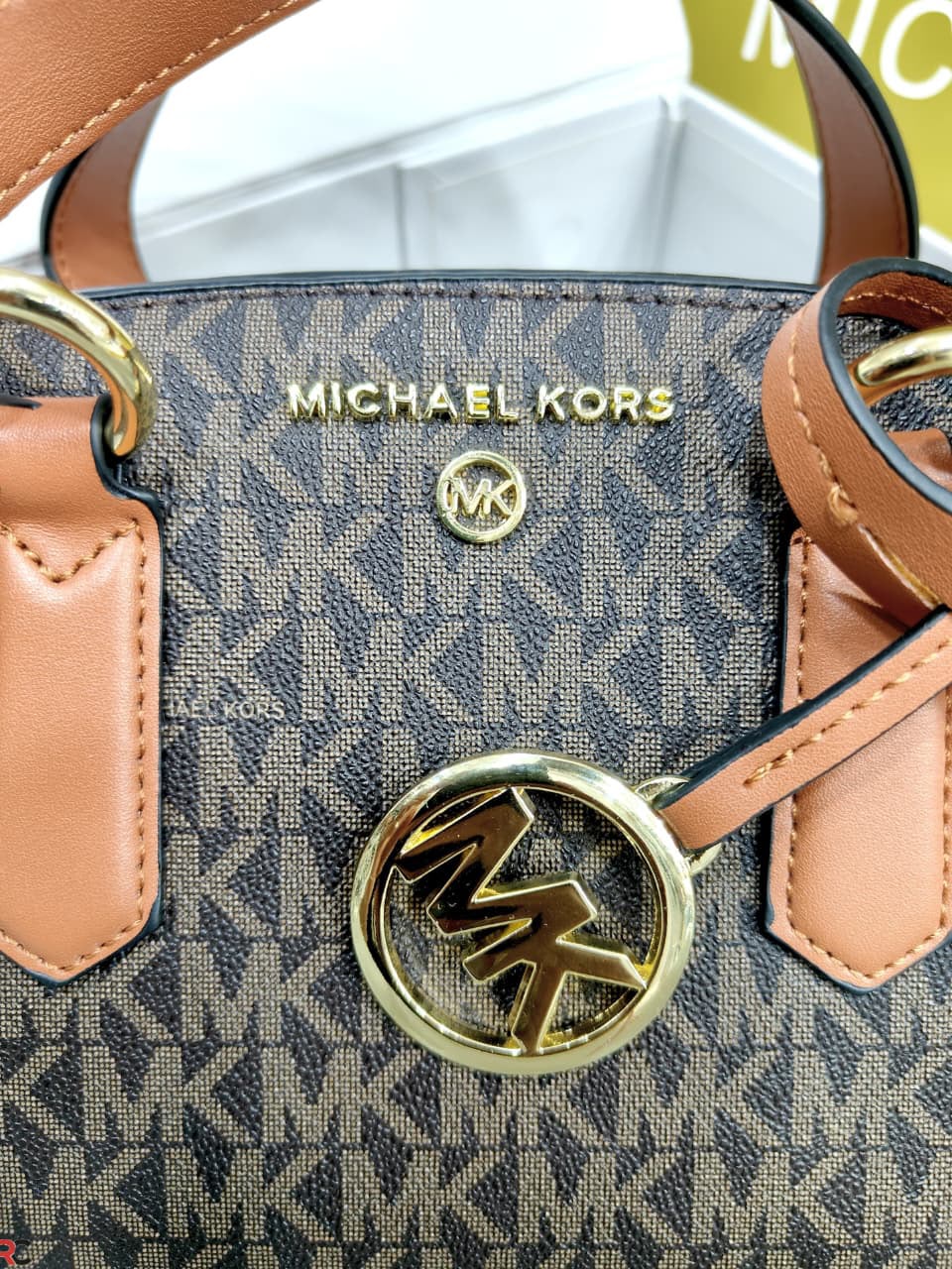 Michael Kors Emma Brown Signature monogram and charm detail