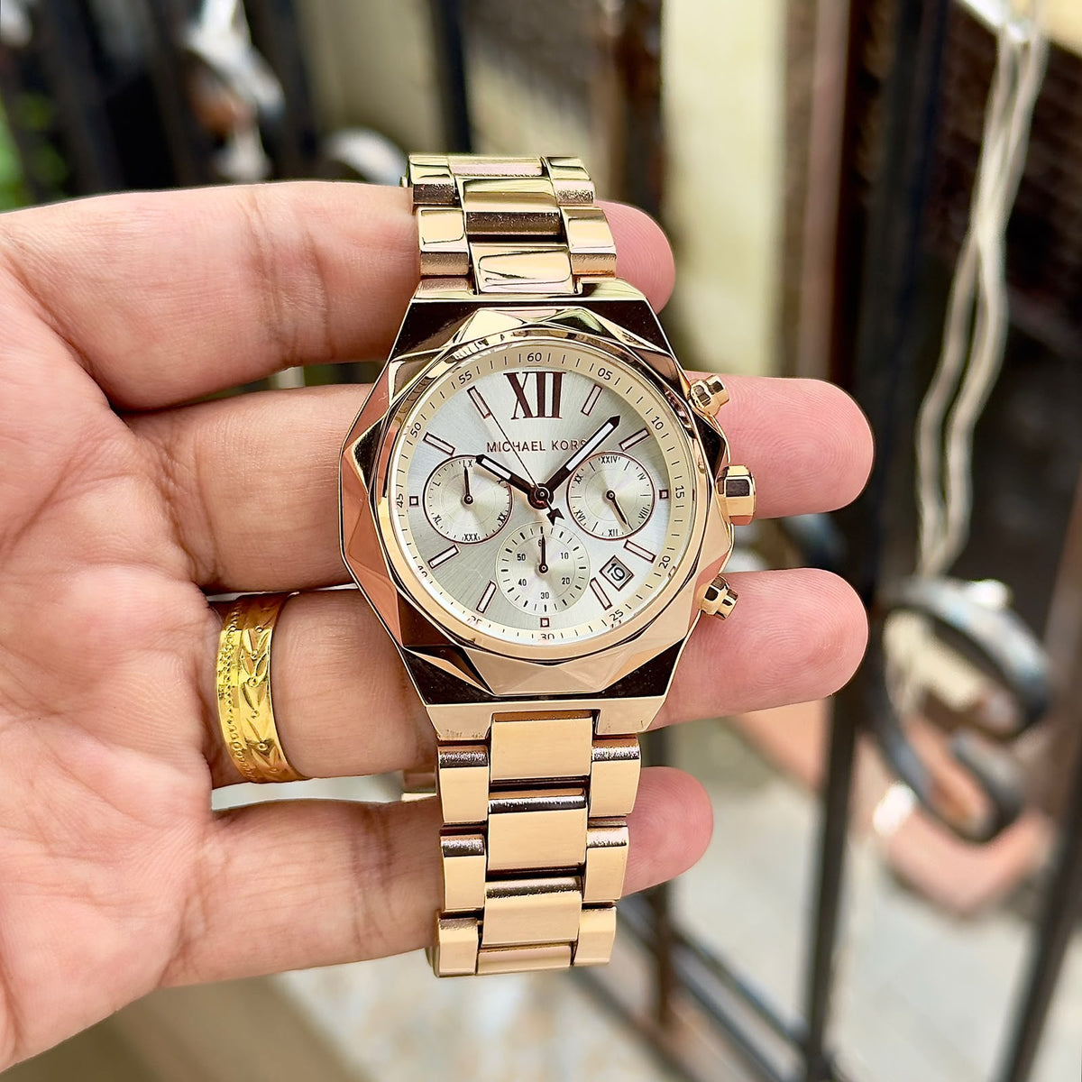 Original supplier image of gold-tone Michael Kors watch with silver dial