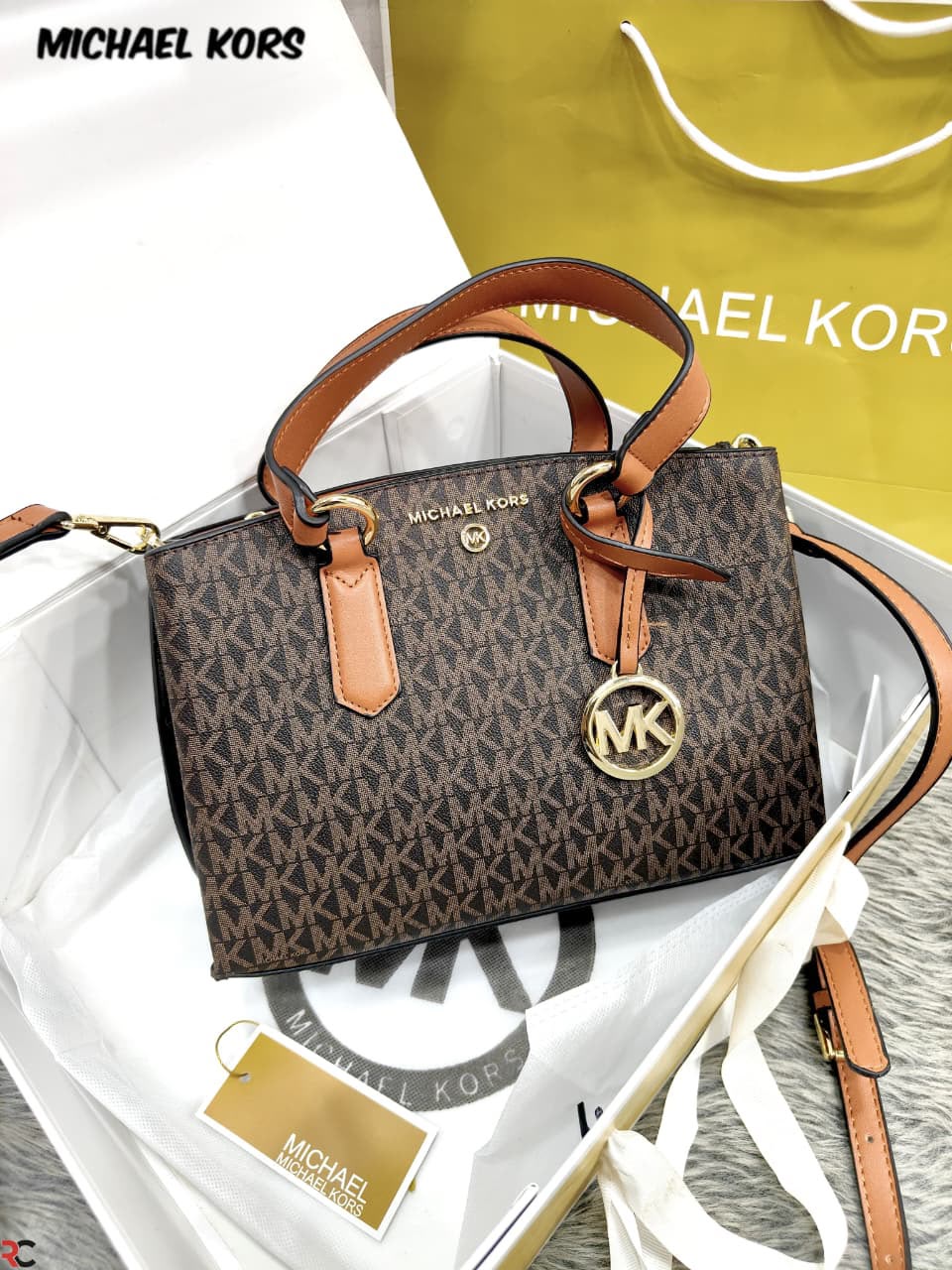 Michael Kors Emma Brown Signature handbag front view with branded box