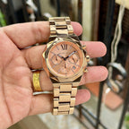 Original supplier image of rose-gold-tone Michael Kors watch with rose dial