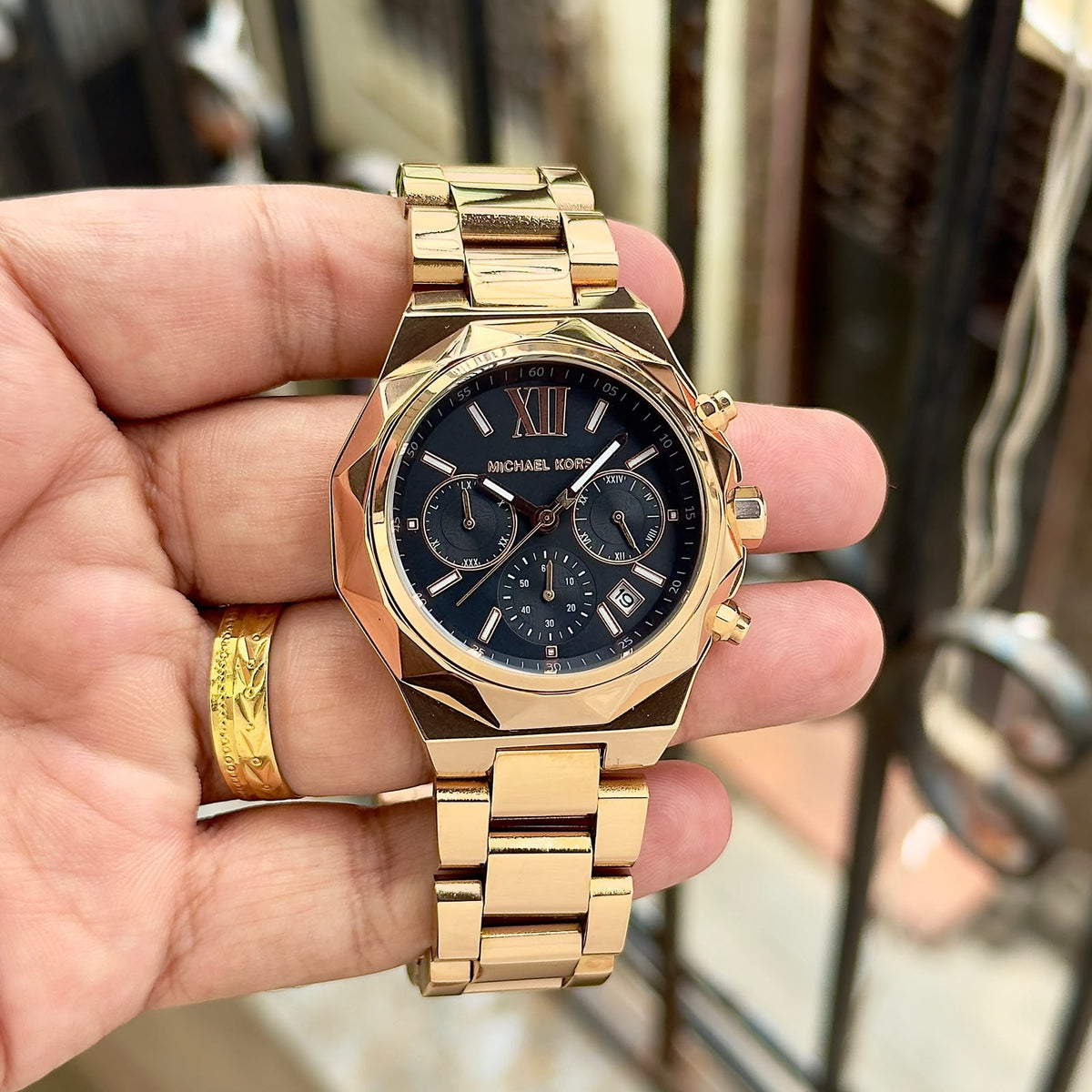 Original supplier image of gold-tone Michael Kors watch with black dial