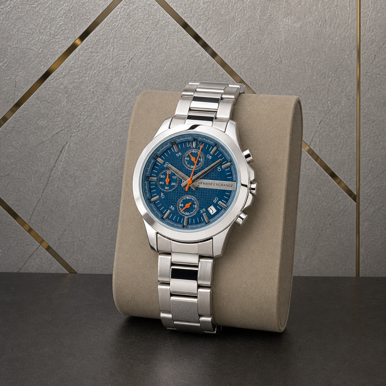 Blue dial Armani Exchange Chronograph against the grey and gold office wall