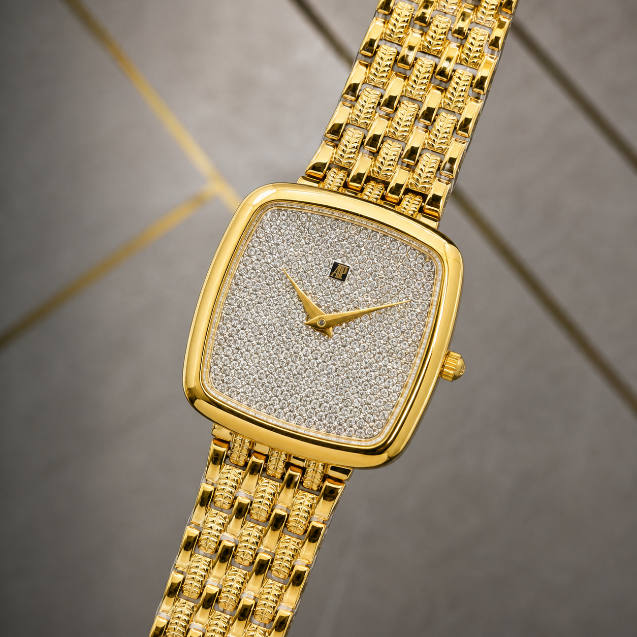 Close-up of crystal-set dial and gold multi-link bracelet