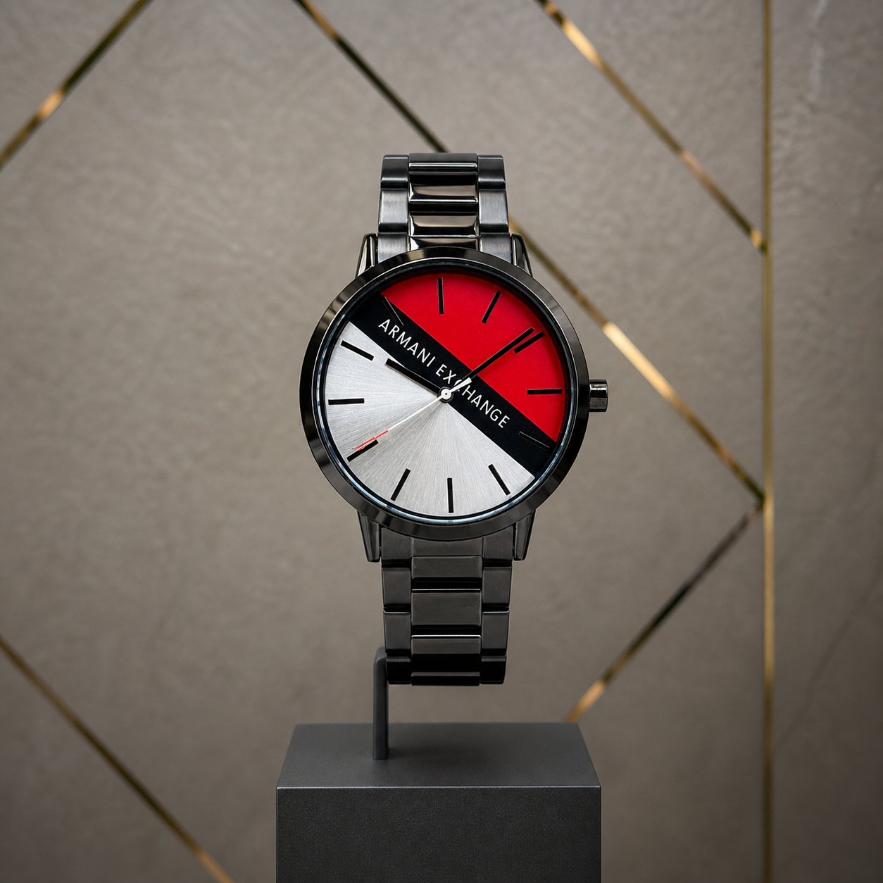 Armani Exchange AX2725 Cayde tri-color watch against gray and gold office wall