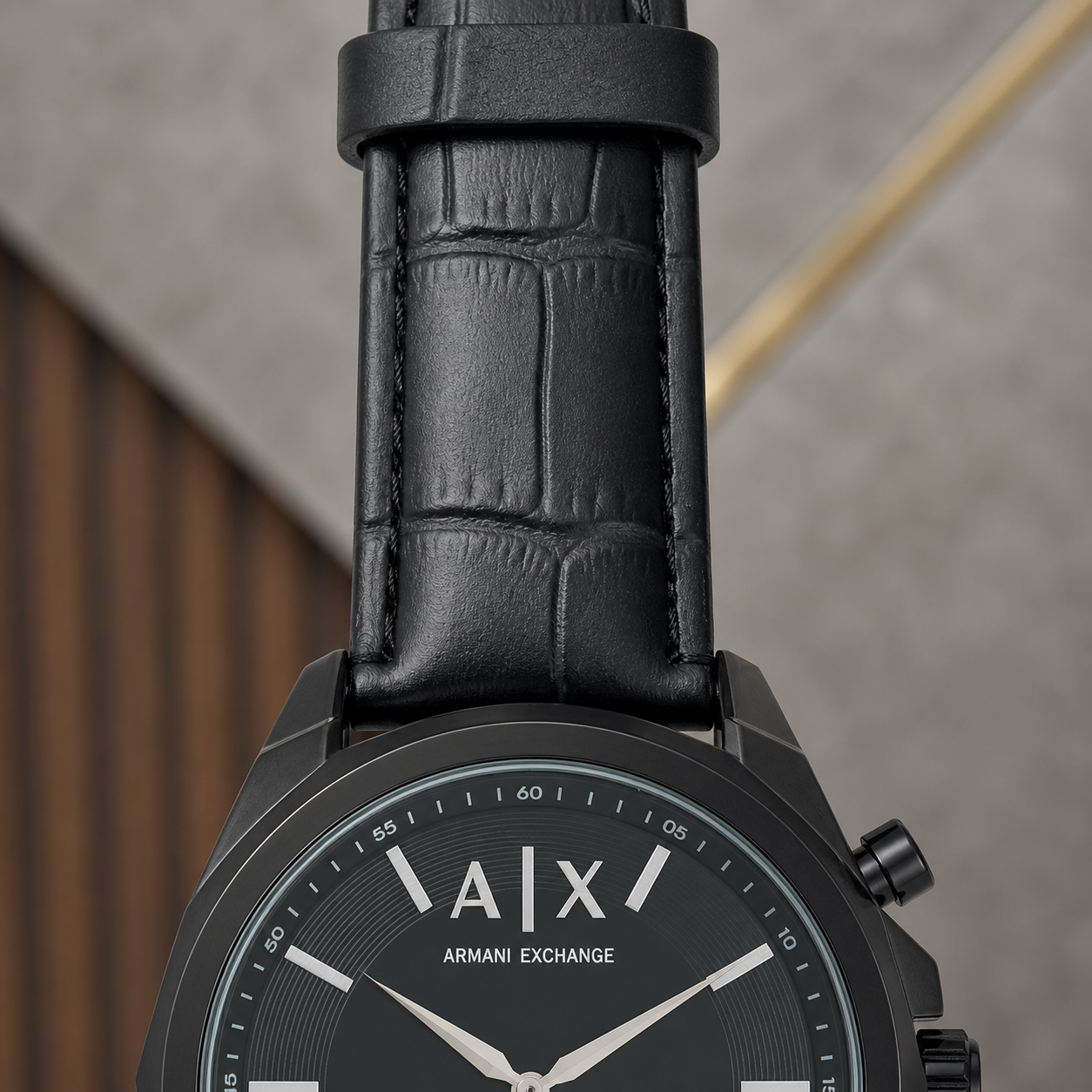 PrimePicks black watch case and crocodile-embossed strap detail