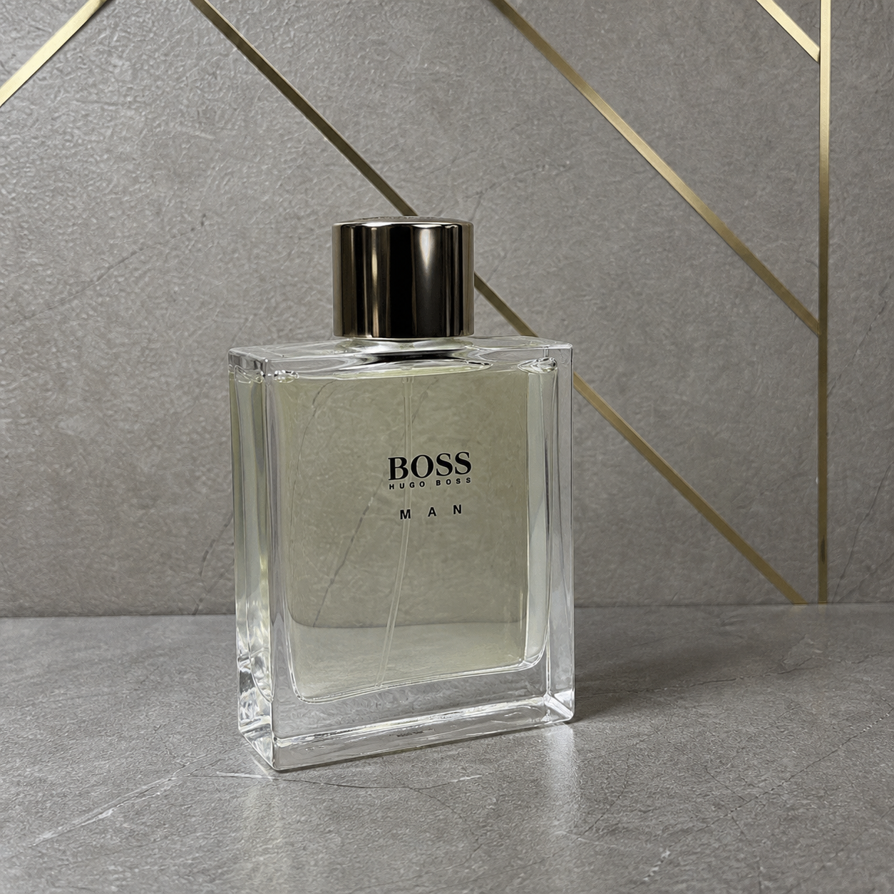 Boss Man Eau de Toilette tester 100ml bottle against the PrimePicks stone wall