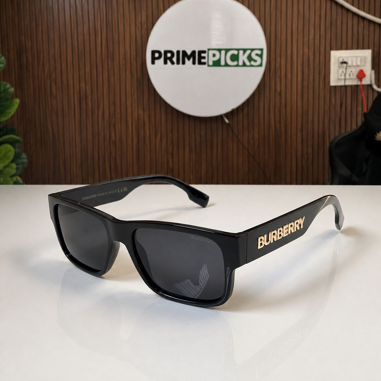 Burberry black rectangular sunglasses beside the PrimePicks sign