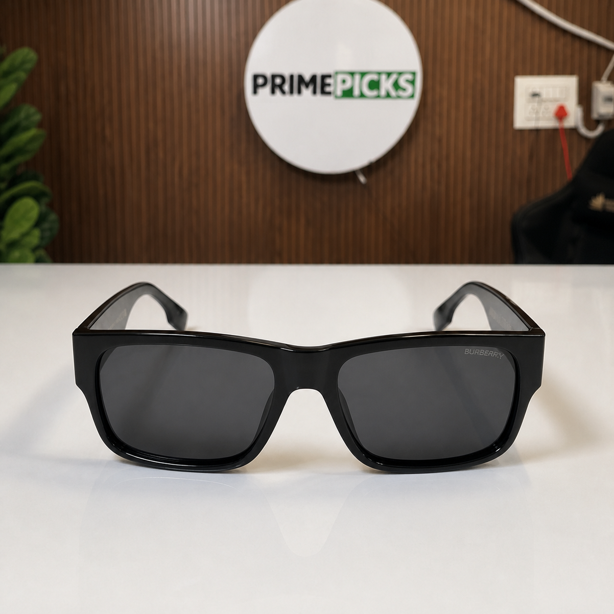 Front view of Burberry black rectangular sunglasses in the PrimePicks office