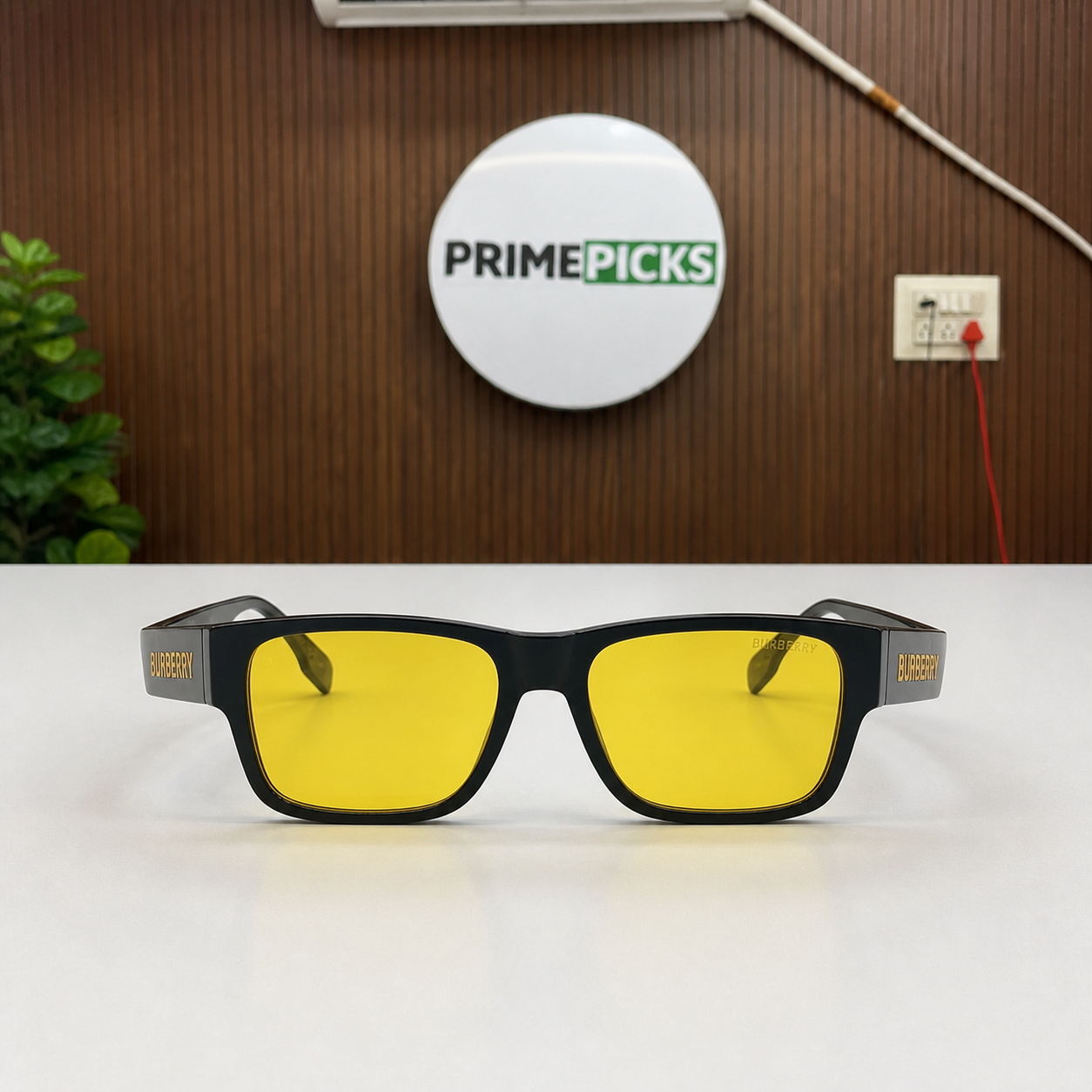 Front view of Burberry black rectangular sunglasses with yellow lenses