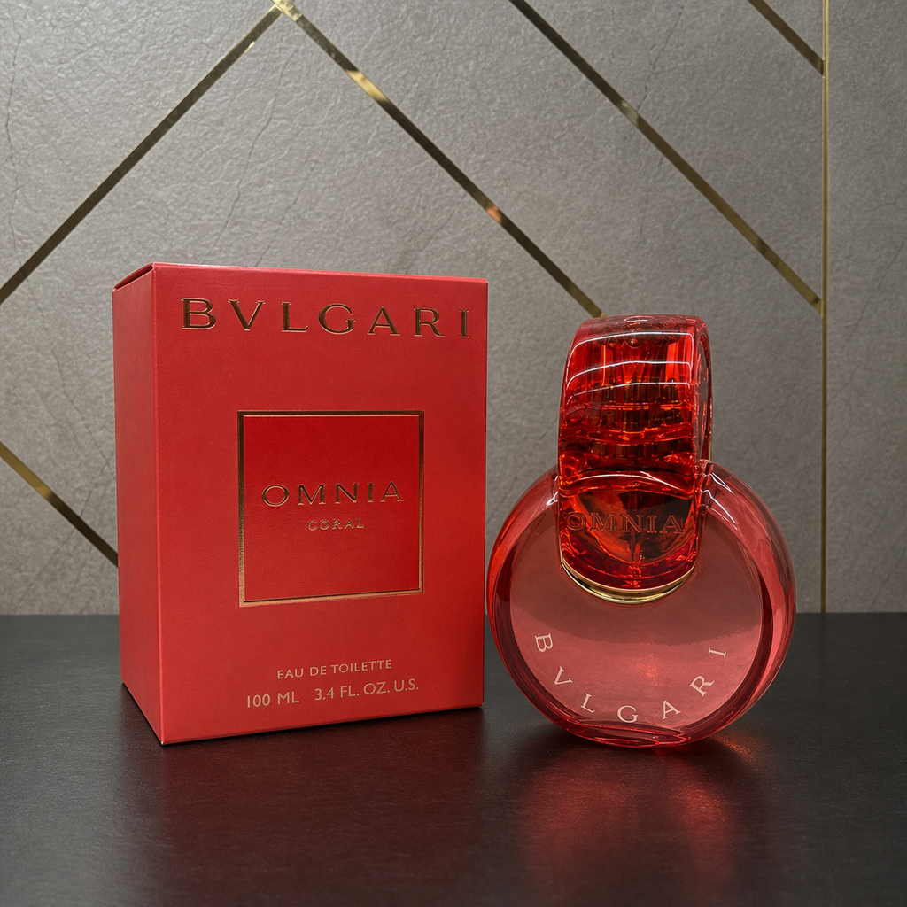 Bvlgari Omnia Coral perfume and box against the grey and gold office wall