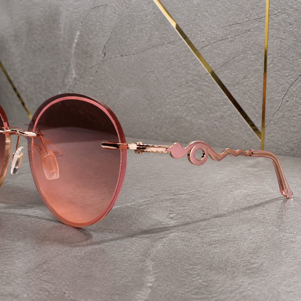 Bvlgari rose-gold round gradient sunglasses temple detail at PrimePicks