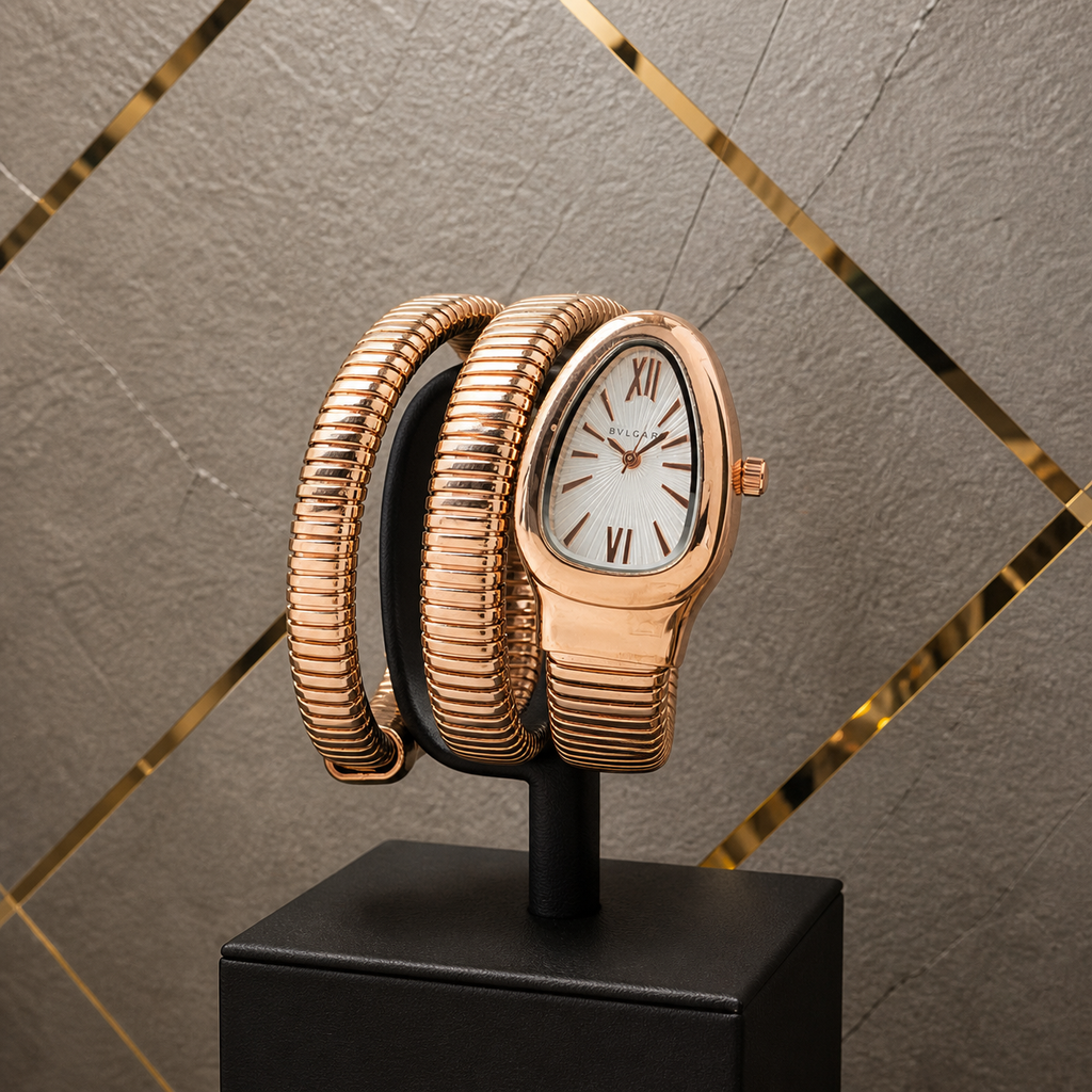 Bvlgari Serpenti rose-gold triple-coil watch on gray and gold office wall