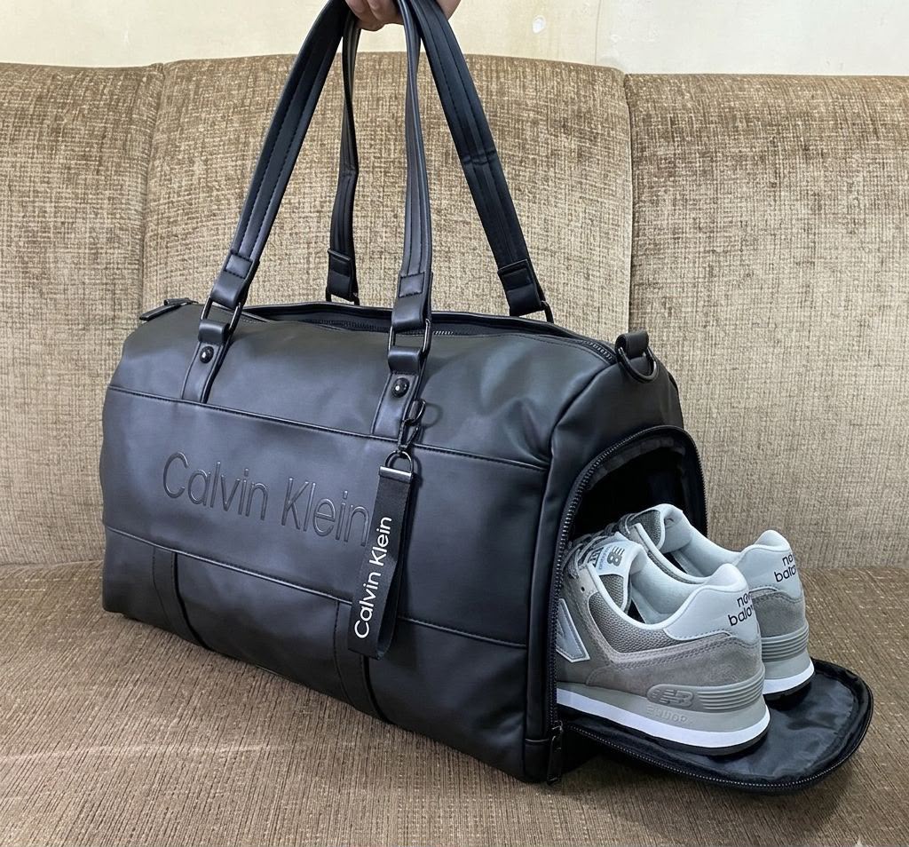 Calvin Klein black duffle bag with side shoe compartment open
