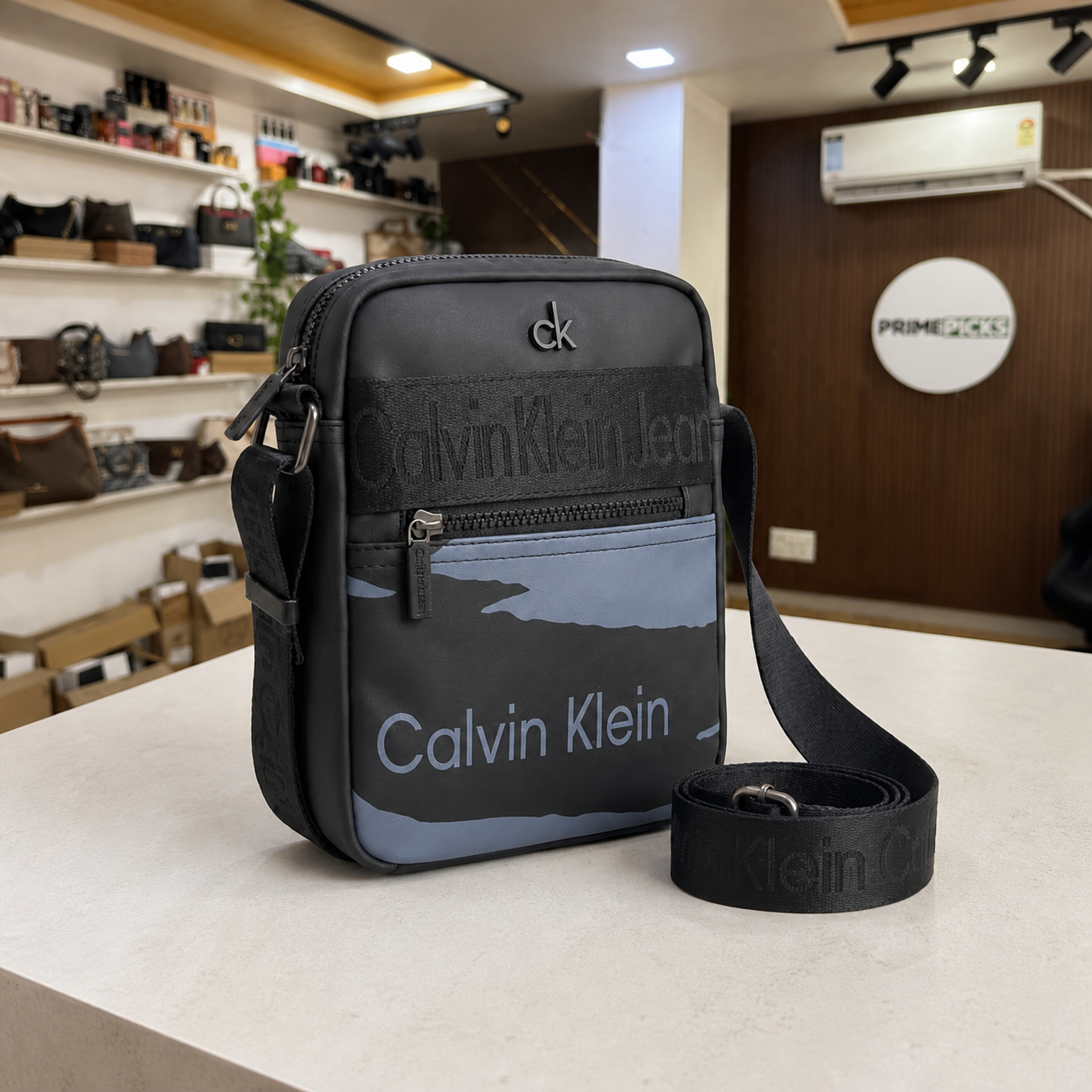 Calvin Klein Jeans messenger bag side and adjustable strap detail