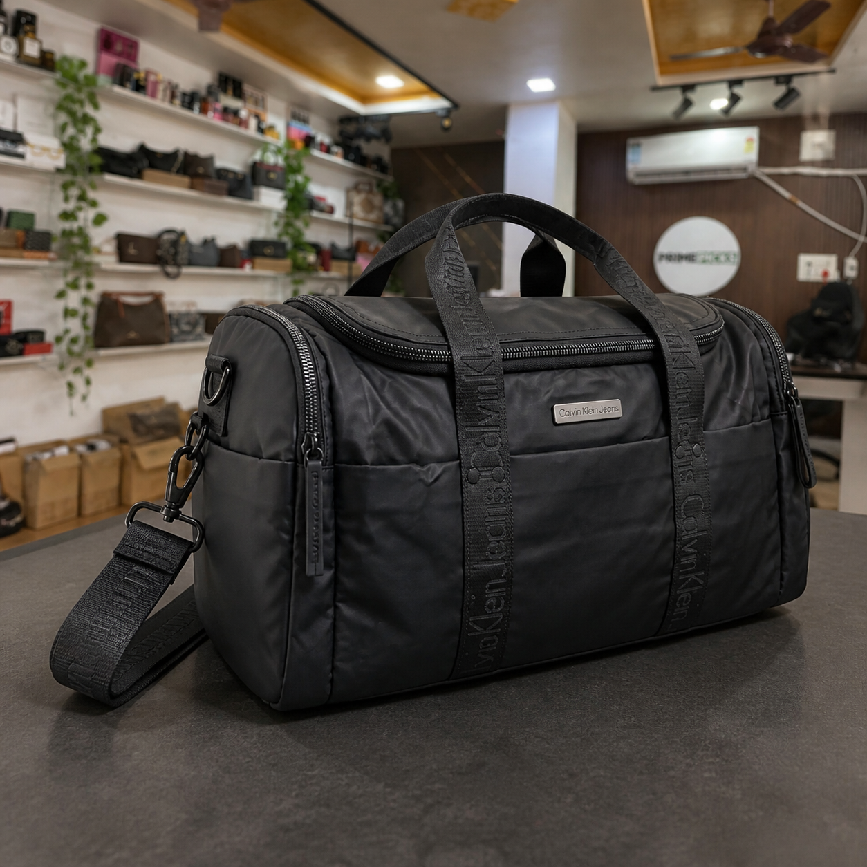 Calvin Klein Jeans black duffel bag side pocket and shoulder strap