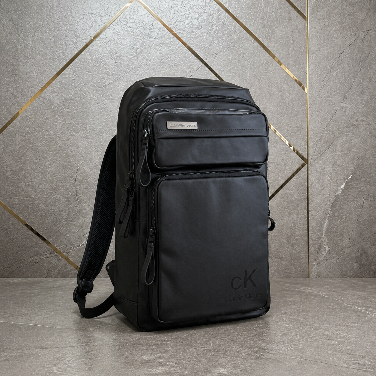 Calvin Klein Jeans black multi-compartment backpack three-quarter view