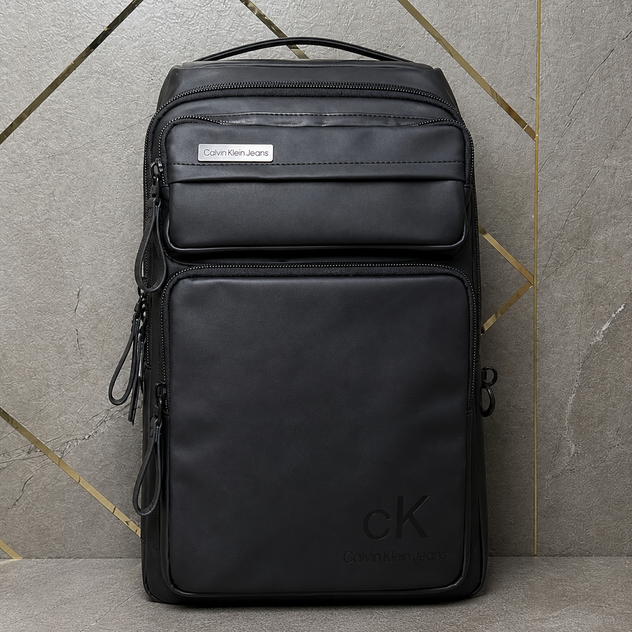 Calvin Klein Jeans backpack front zip pocket and plaque details