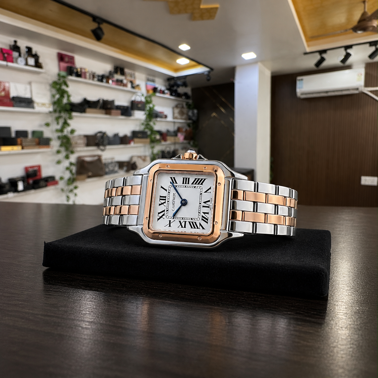 Horizontal view of Cartier square women’s watch on a display pad in the Primepicks office