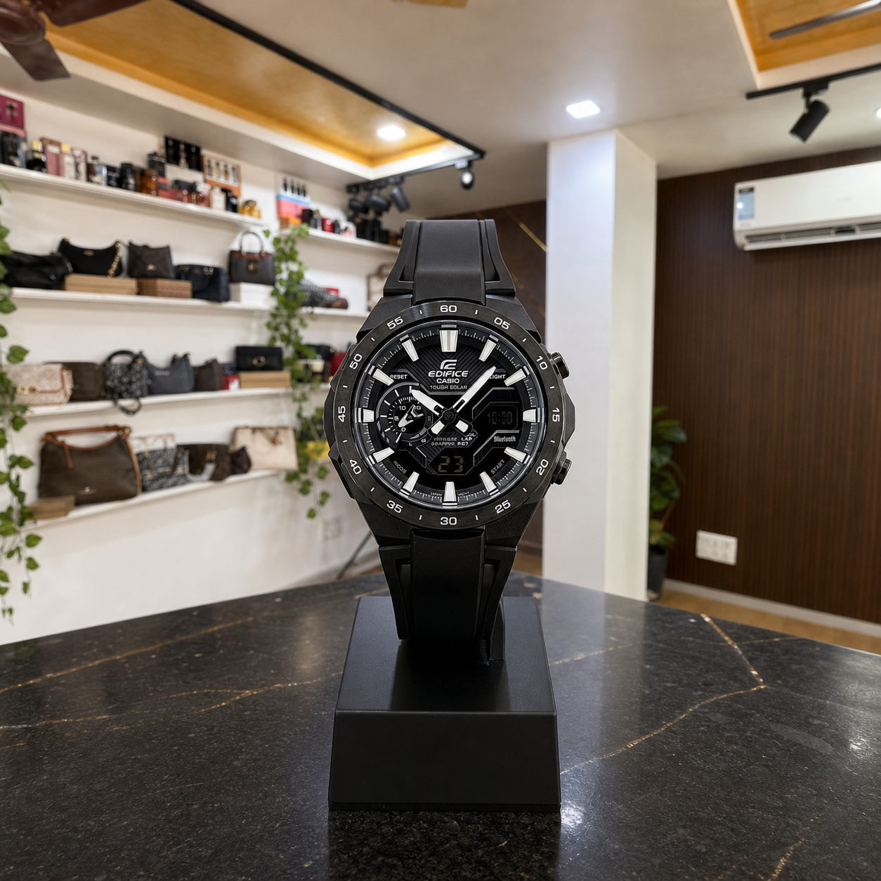 Casio Edifice ECB-2200PB-1A black watch displayed upright in the full Primepicks office interior