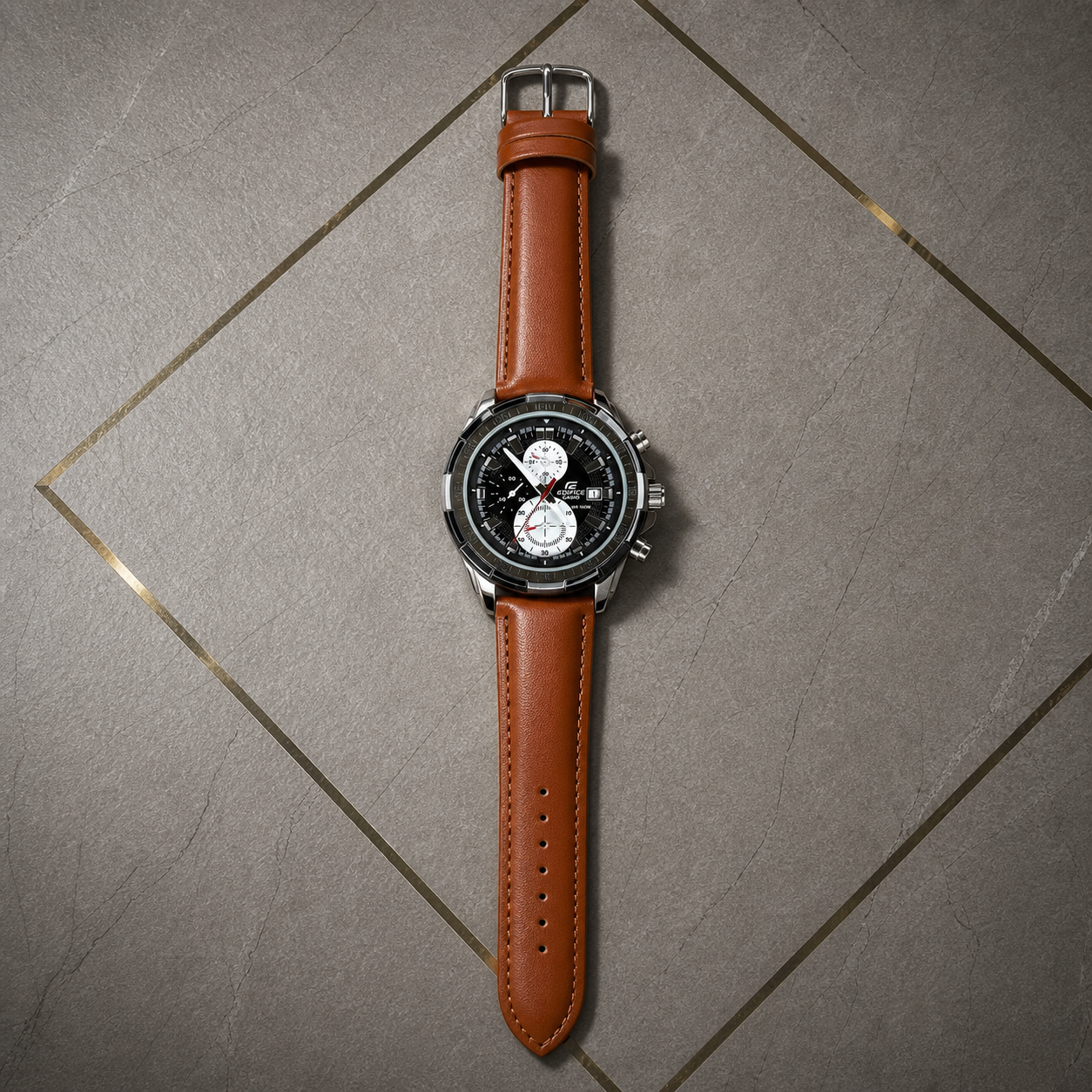 Casio Edifice EFR-539L brown leather chronograph watch on gray office wall