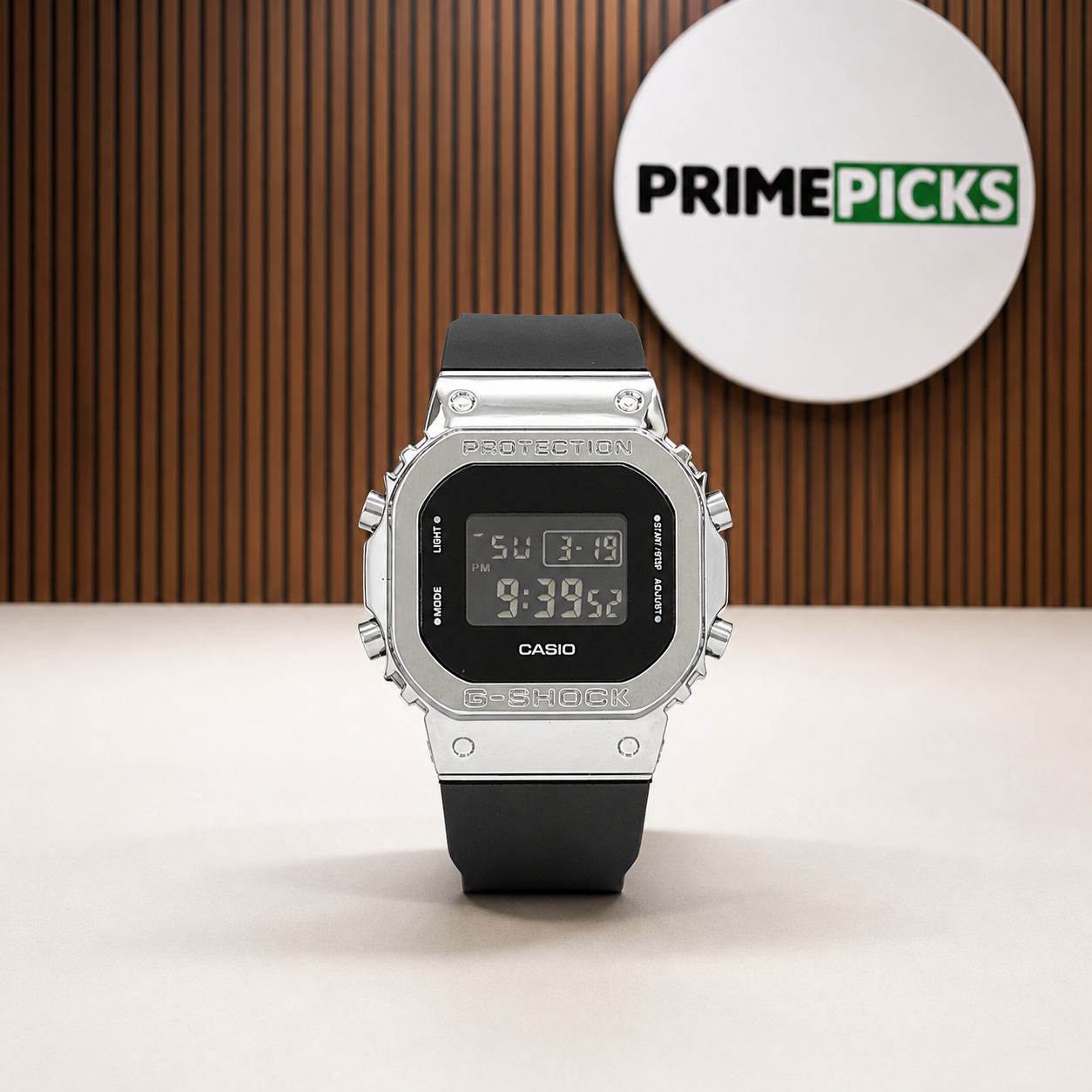 Casio G-Shock G-Steel GM-5600 watch beside the round PrimePicks logo board