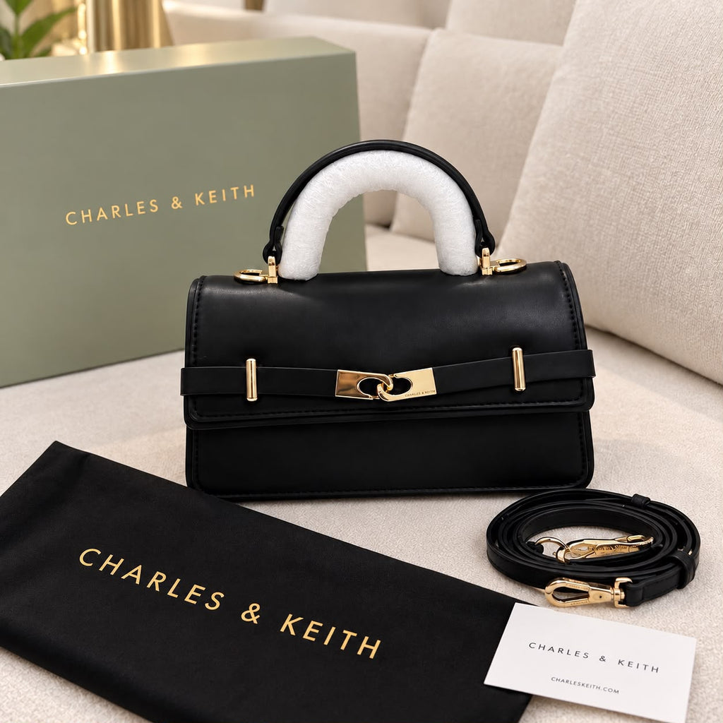 Black Charles & Keith Arlet bag front view with shoulder strap and dustcover