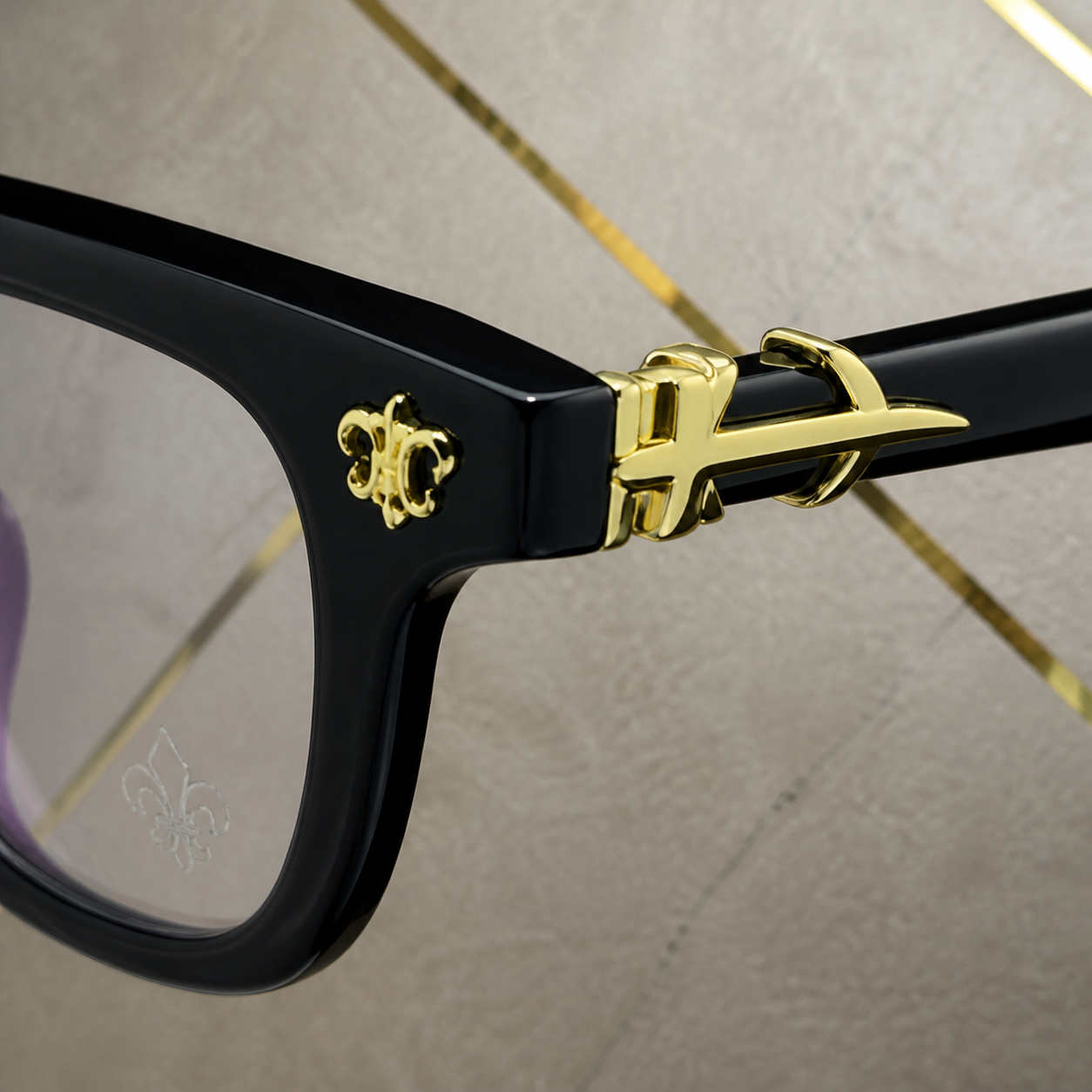 Chrome Heart frame gold-tone emblem and hinge detail