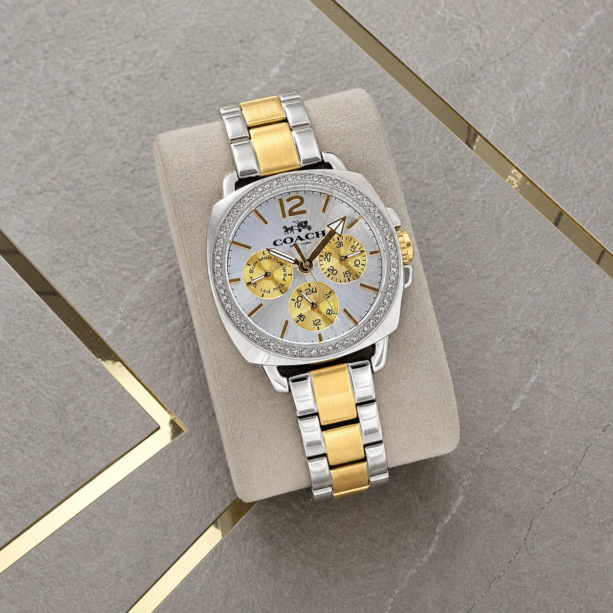 Coach Boyfriend two-tone bracelet and dial detail