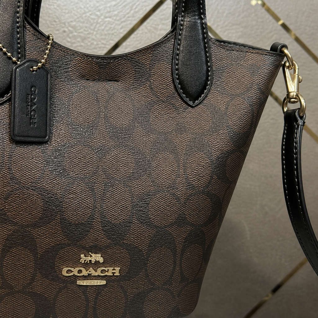 Coach bucket bag logo and signature pattern detail
