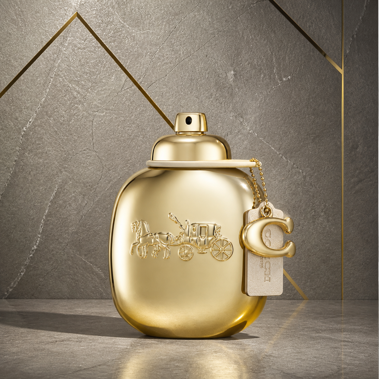 Coach Gold Parfum 90ml bottle against the PrimePicks stone wall