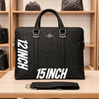 Coach black signature laptop bag front view with 15 inch size reference