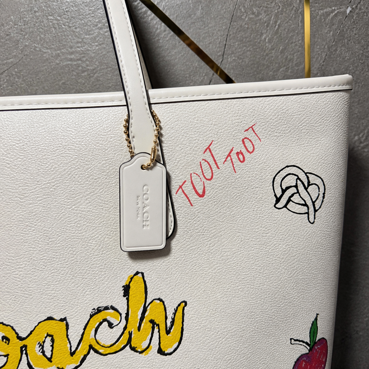 Coach Sketch Print Tote Bag handle, hangtag and sketch print detail