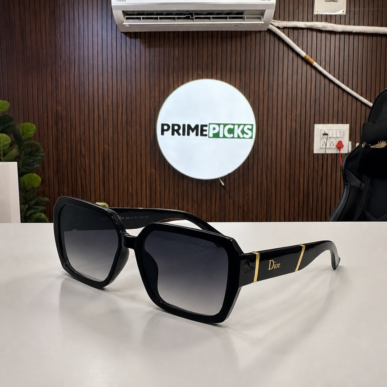 Dior black geometric gradient sunglasses hero view in PrimePicks office
