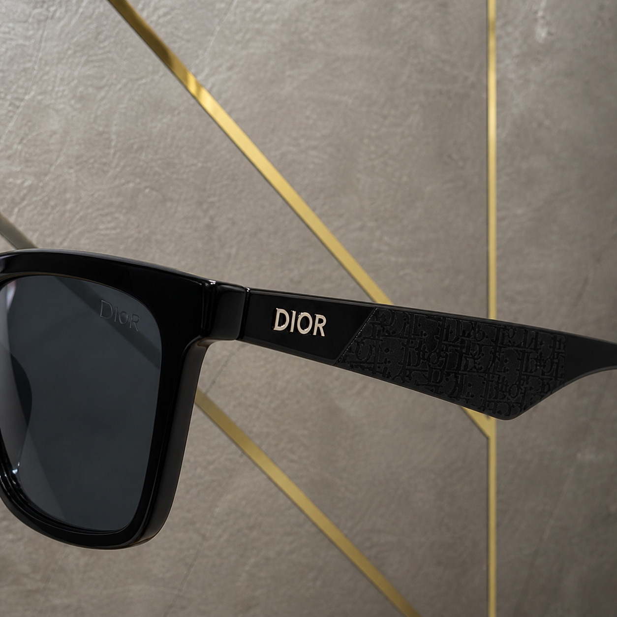 Dior black sunglasses patterned temple and wordmark detail