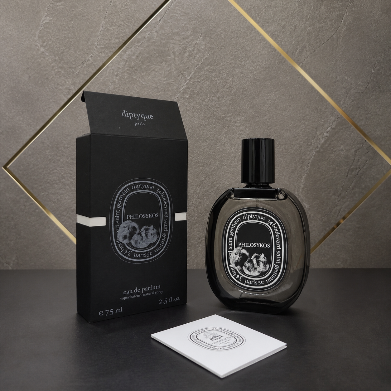 Diptyque Philosykos Eau de Parfum 75ml with box and booklet on stone and gold office wall