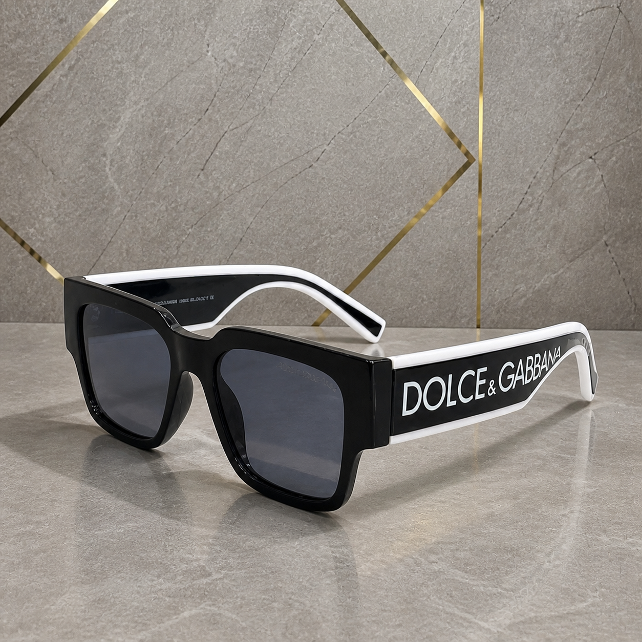Dolce & Gabbana black oversized sunglasses alternate angle with white-edged arms