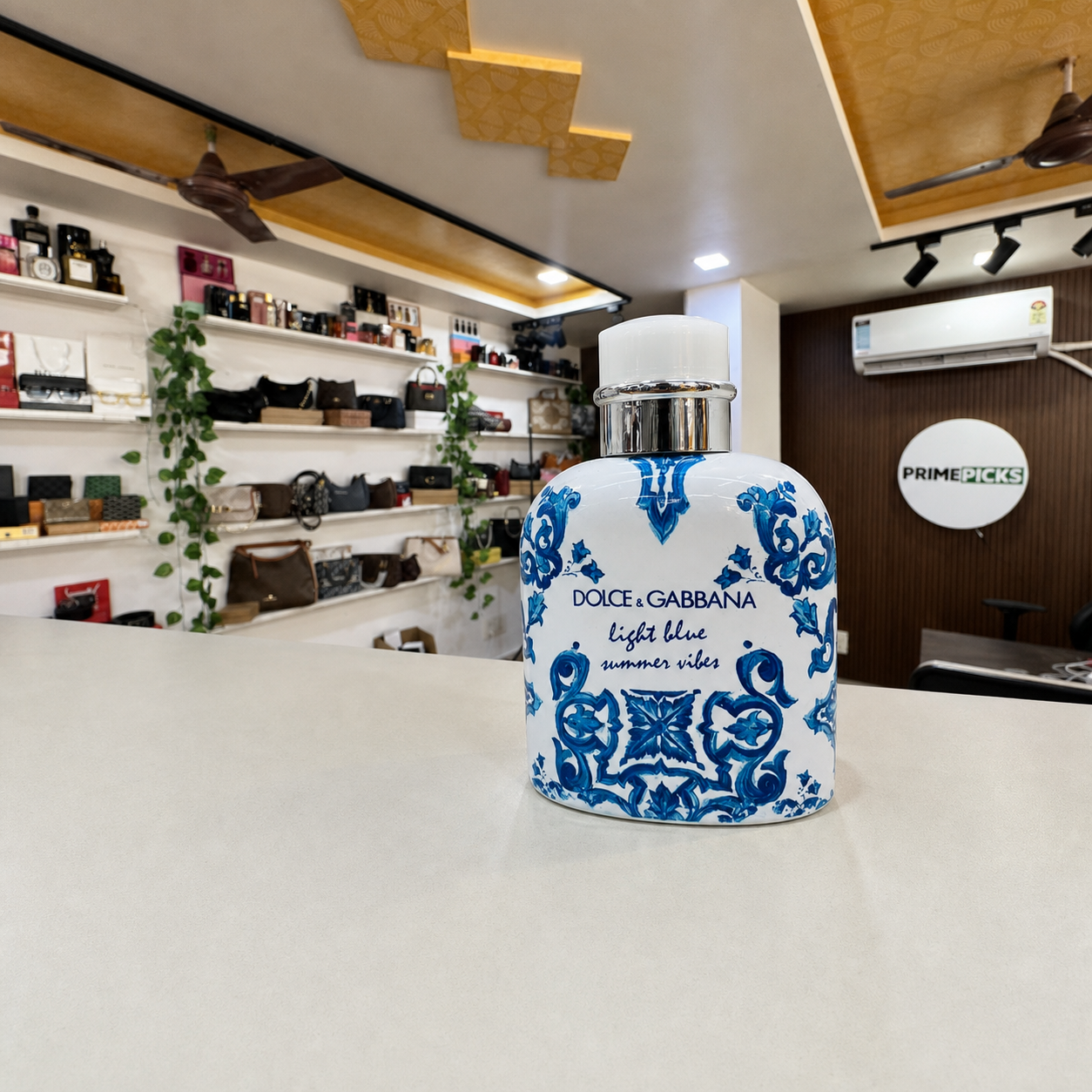 Dolce & Gabbana Light Blue Summer Vibes Pour Homme bottle inside the PrimePicks store