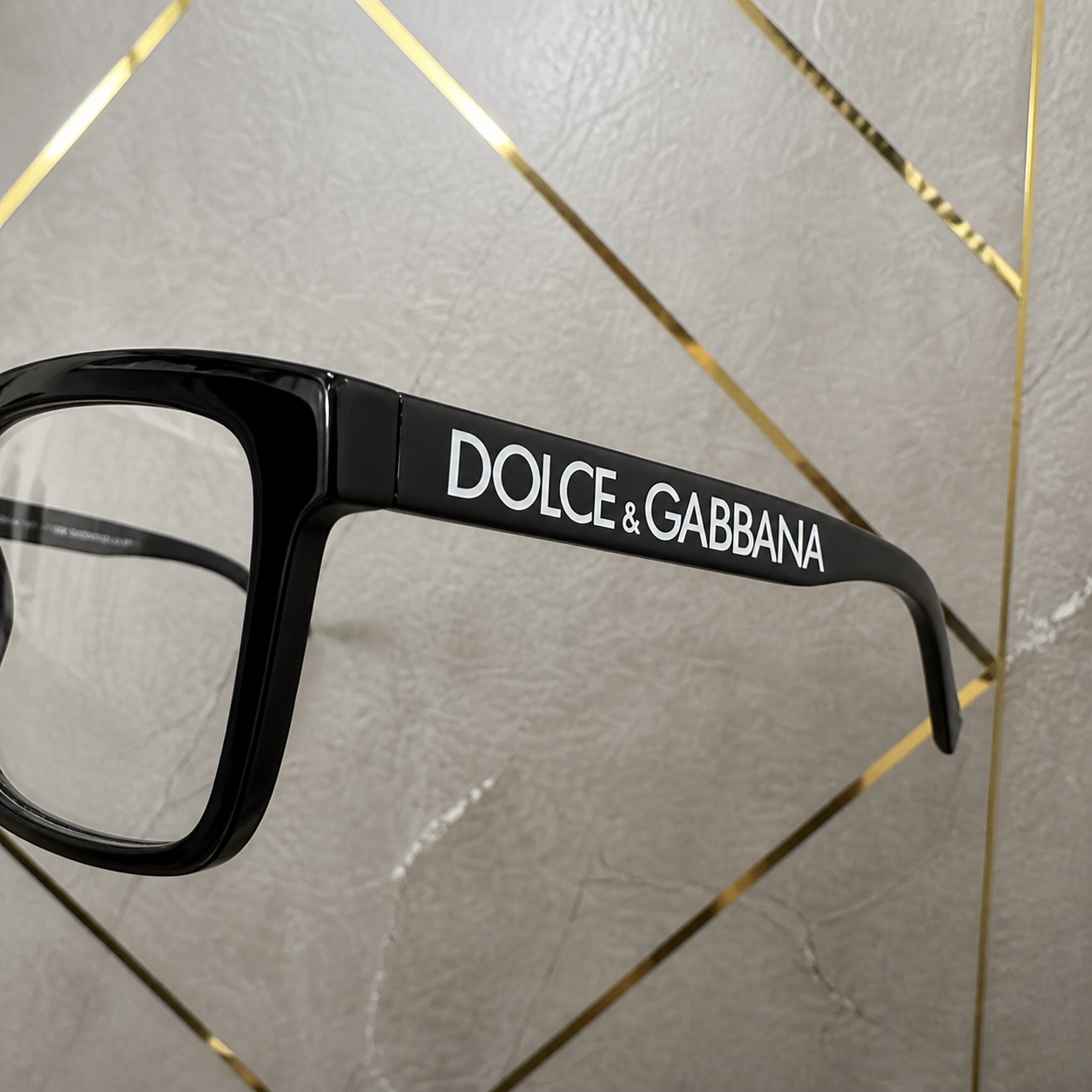 Dolce & Gabbana clear-lens frame white logo temple detail