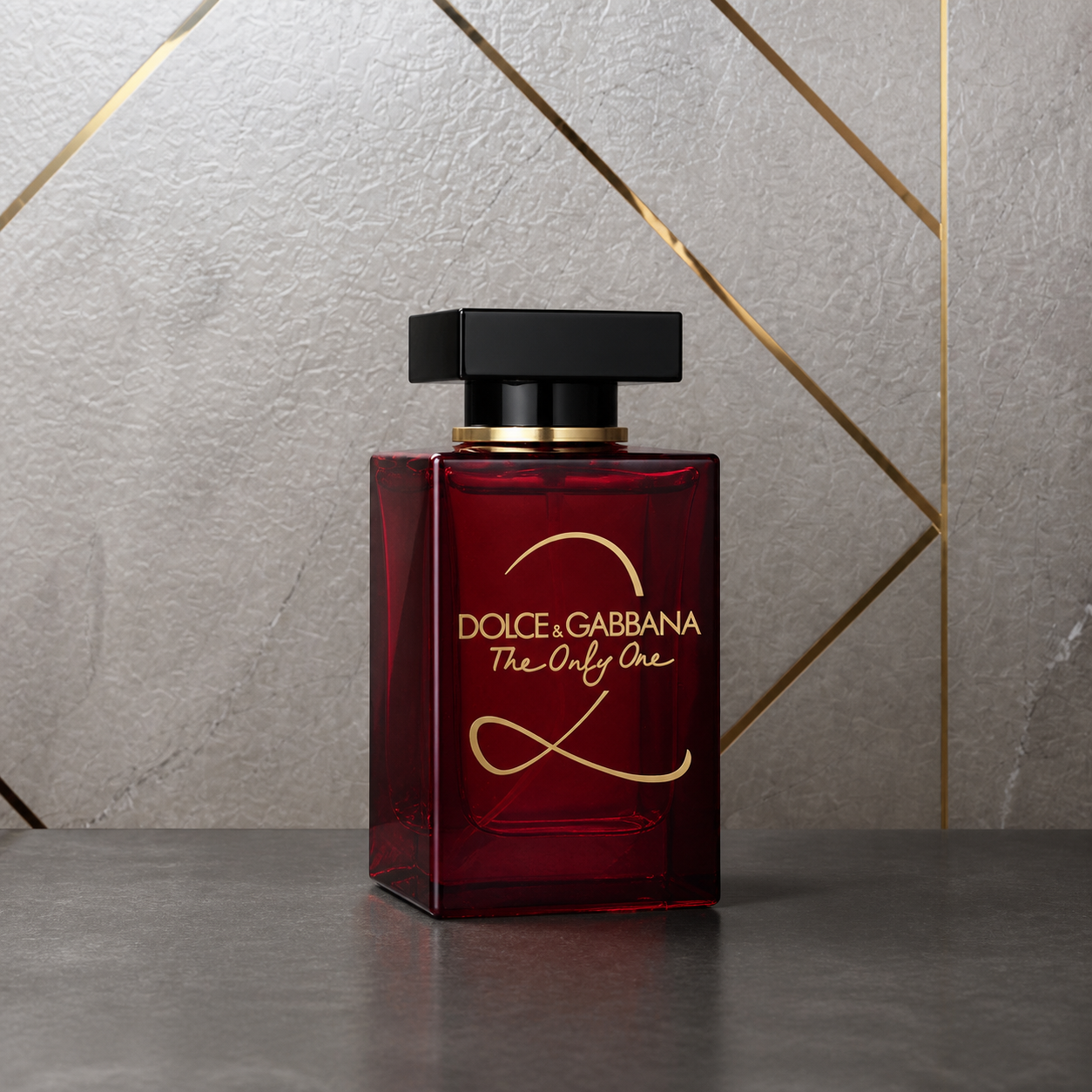 Dolce & Gabbana The Only One Eau de Parfum 100ml bottle against the PrimePicks stone wall