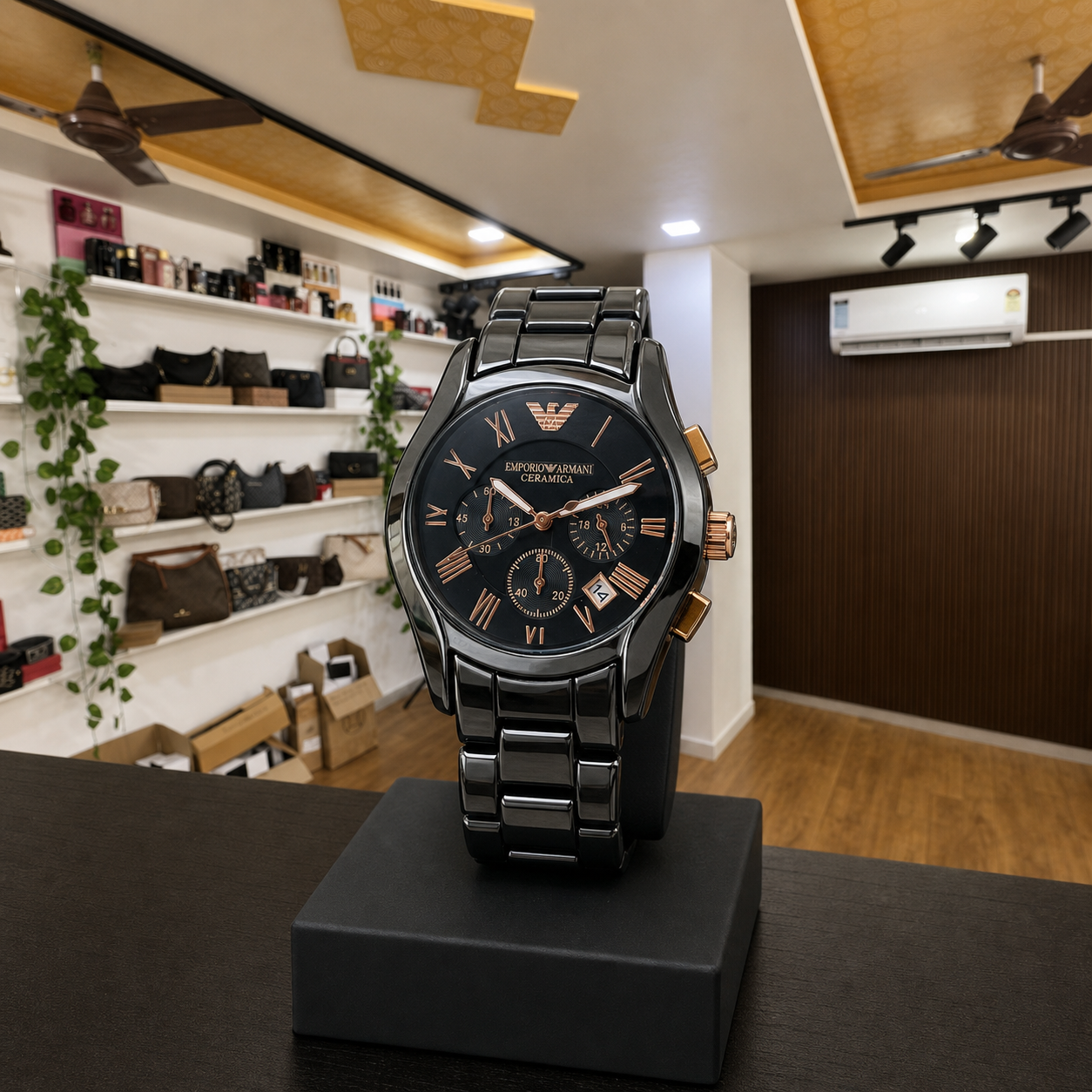 Emporio Armani AR1410 black bracelet watch displayed upright in the full Primepicks office interior