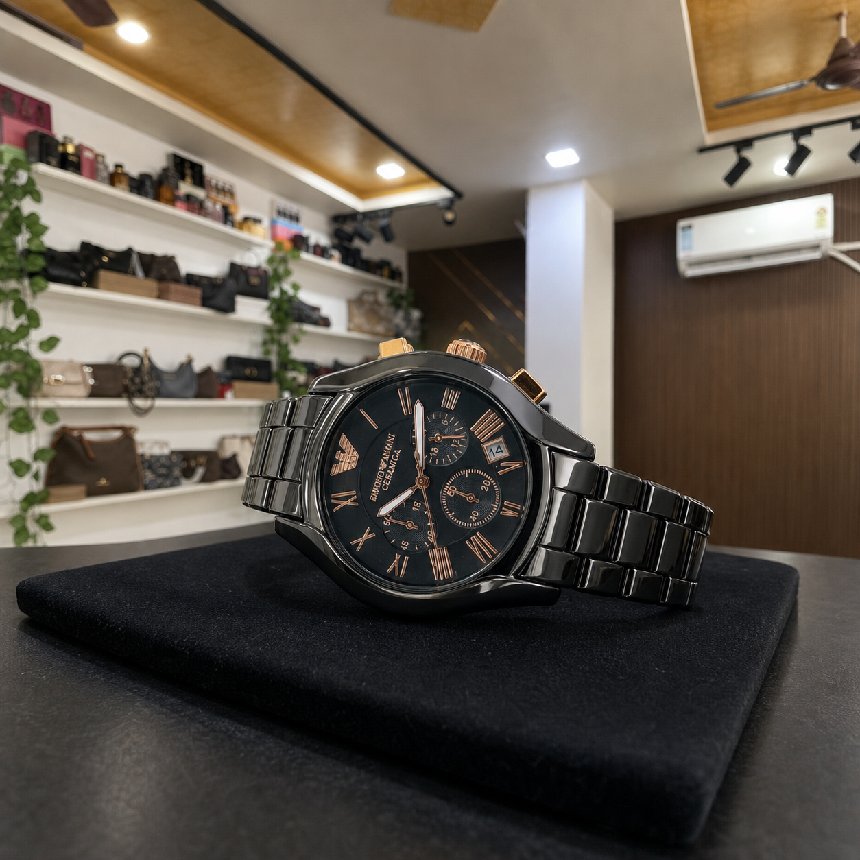 Horizontal view of Emporio Armani AR1410 black chronograph watch on a display pad in the Primepicks office
