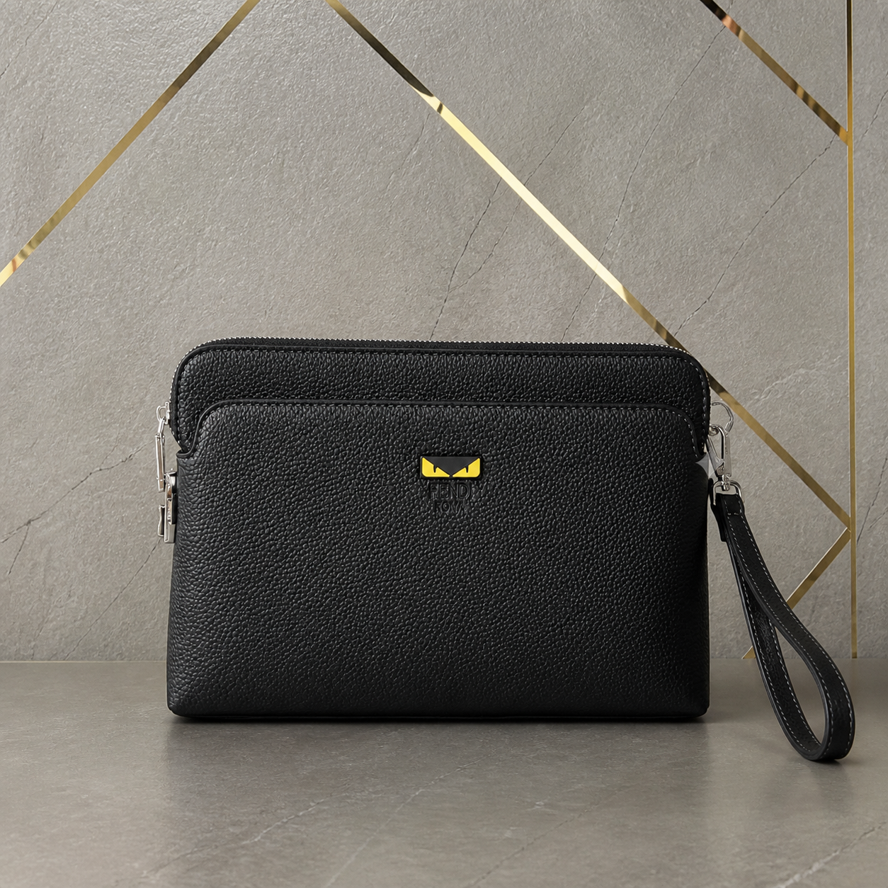 Fendi Monster Eyes black pouch three-quarter office view