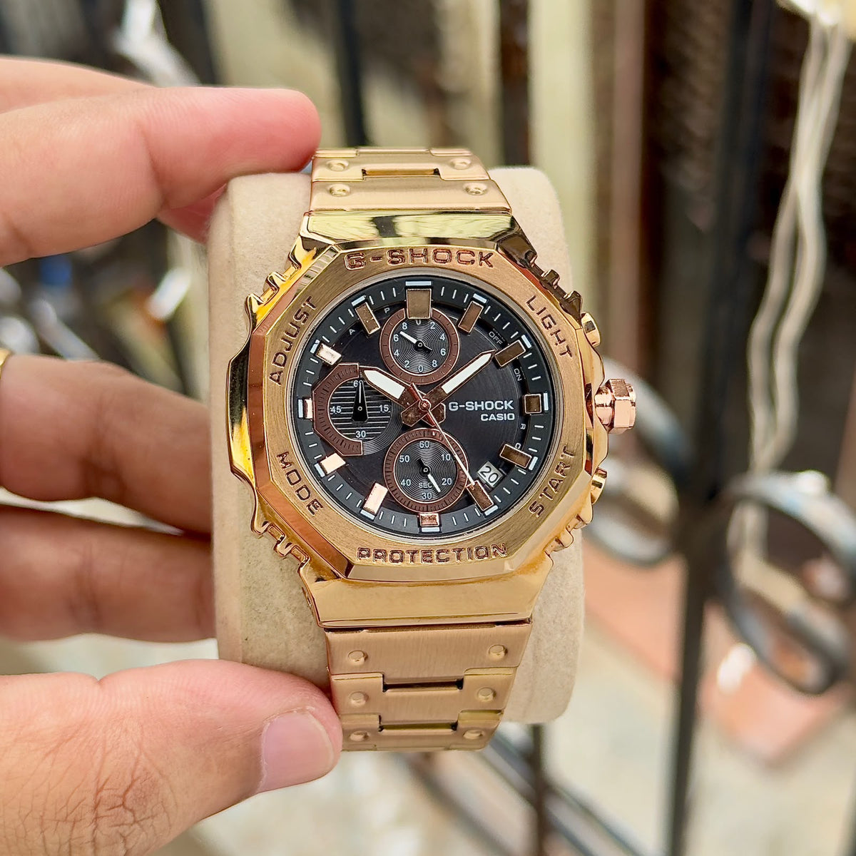 Close-up of Casio G-Shock GMC-B2100D rose-gold-tone watch with black dial