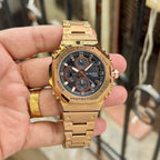 Hand-held view of Casio G-Shock GMC-B2100D rose-gold-tone watch