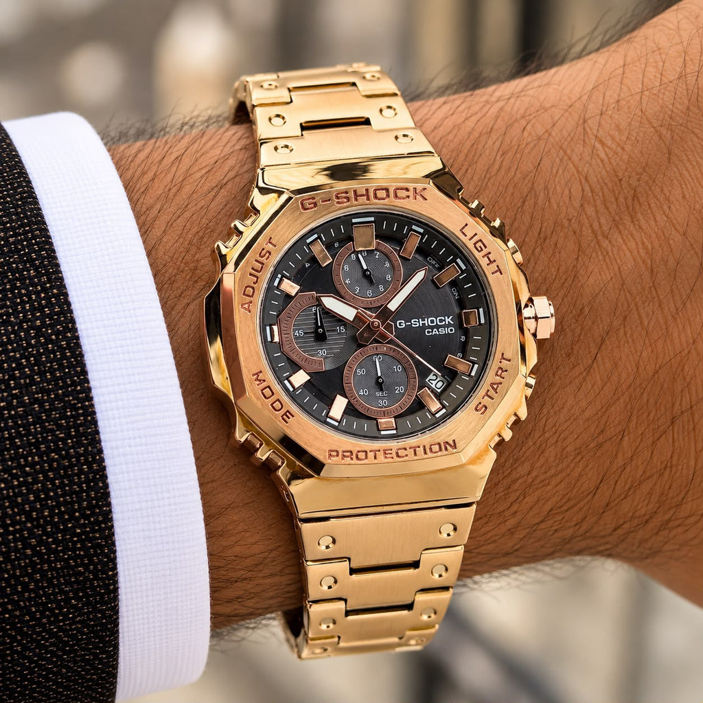 Casio G-Shock GMC-B2100D rose-gold-tone watch worn on wrist